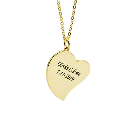 Gold heart-shaped pendant necklace with engraved text on a light gray background