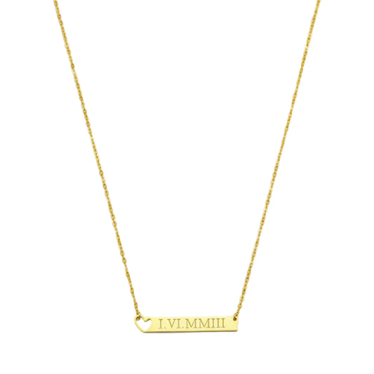Gold necklace with a bar pendant displaying Roman numerals on a white background